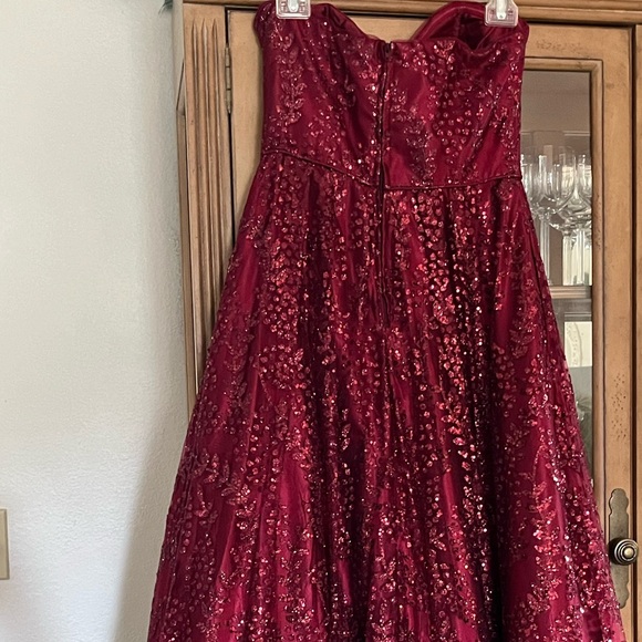 Beautiful strapless burgundy embellished gown. - Picture 3 of 6